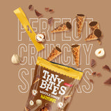 Packaging of Tiny Bites waffle cones with hazelnut flavor on a brown background.