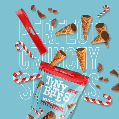 Packaging of Tiny Bites Waffle Cones Peppermint with waffle cones and candy canes on a blue background.