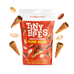 Packaging of Tiny Bites Waffle Cones Peanut Butter with waffle cones and peanuts around on a white background