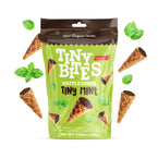 Packaging of Tiny Bites Waffle Cones with mint leaves on a white background